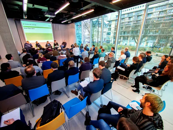 Audience and panel at a discussion event with Peter Langkafel